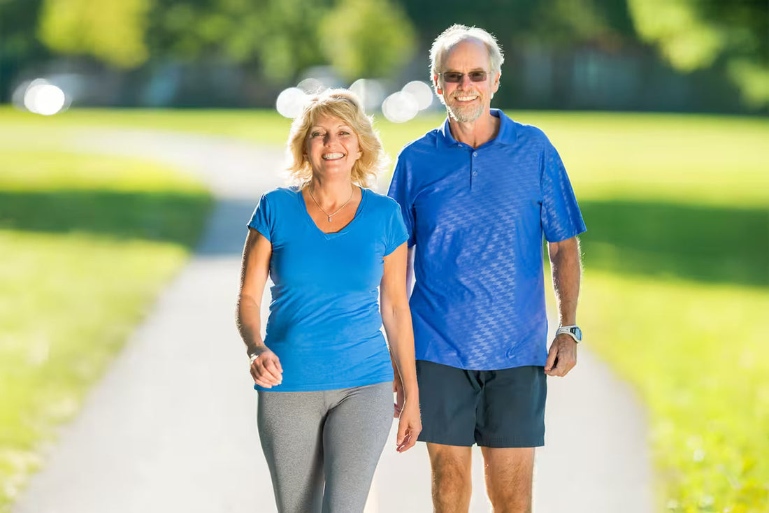 Older adults walking outdoors to support healthy aging and longevity.