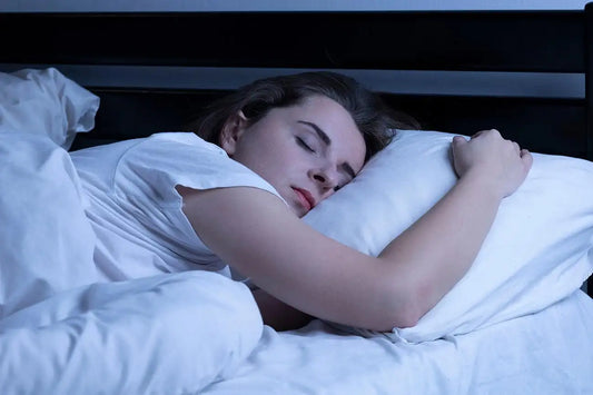 Adult sleeping deeply in a dark bedroom